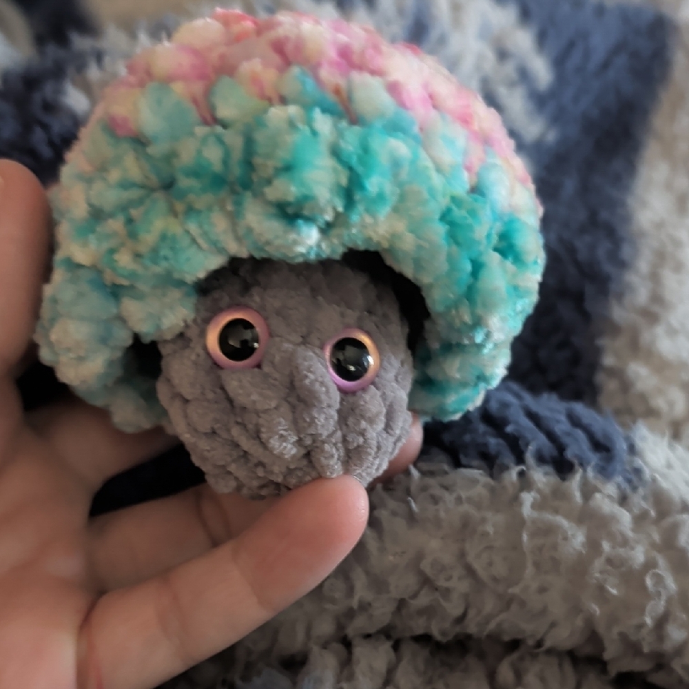 This is a handmade crochet mushroom fidget toy, also known as Mushie Pop